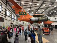 A group of children viewing the erickson aero tanker at the museum in Madras, Oregon
